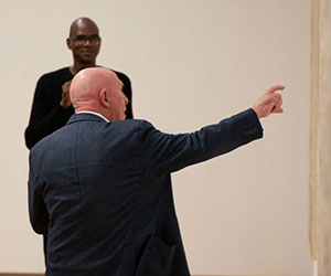 Mark Bradford and Michael Auping in the galleries.