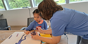 studio with teacher and child