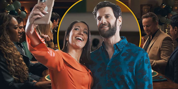 Man and woman taking a selfie on a smartphone