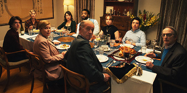 Family sitting at a table during a Jewish Shabbat dinner
