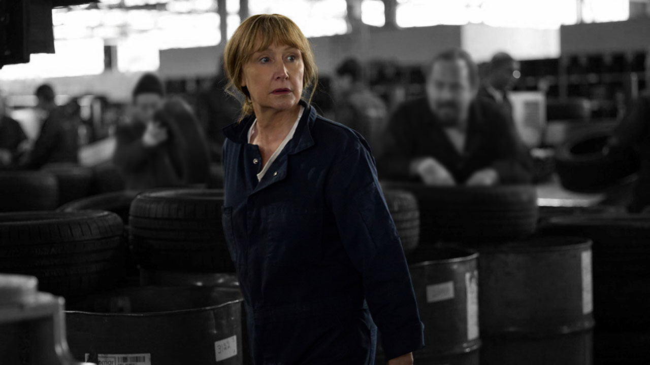 Middle-aged woman working in a tire factory