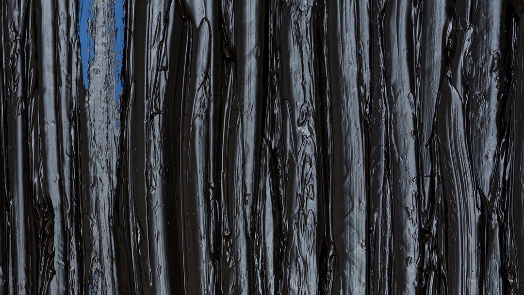 Black textured paint on wood