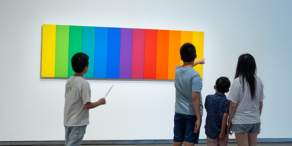 Family looking at artwork