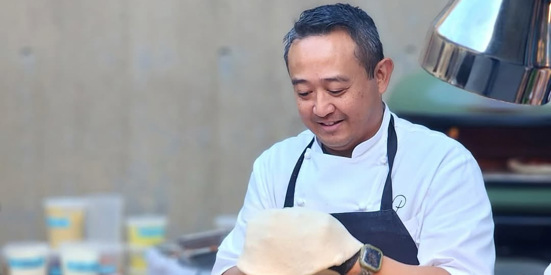 Chef Jett Mora forming dough for pizza