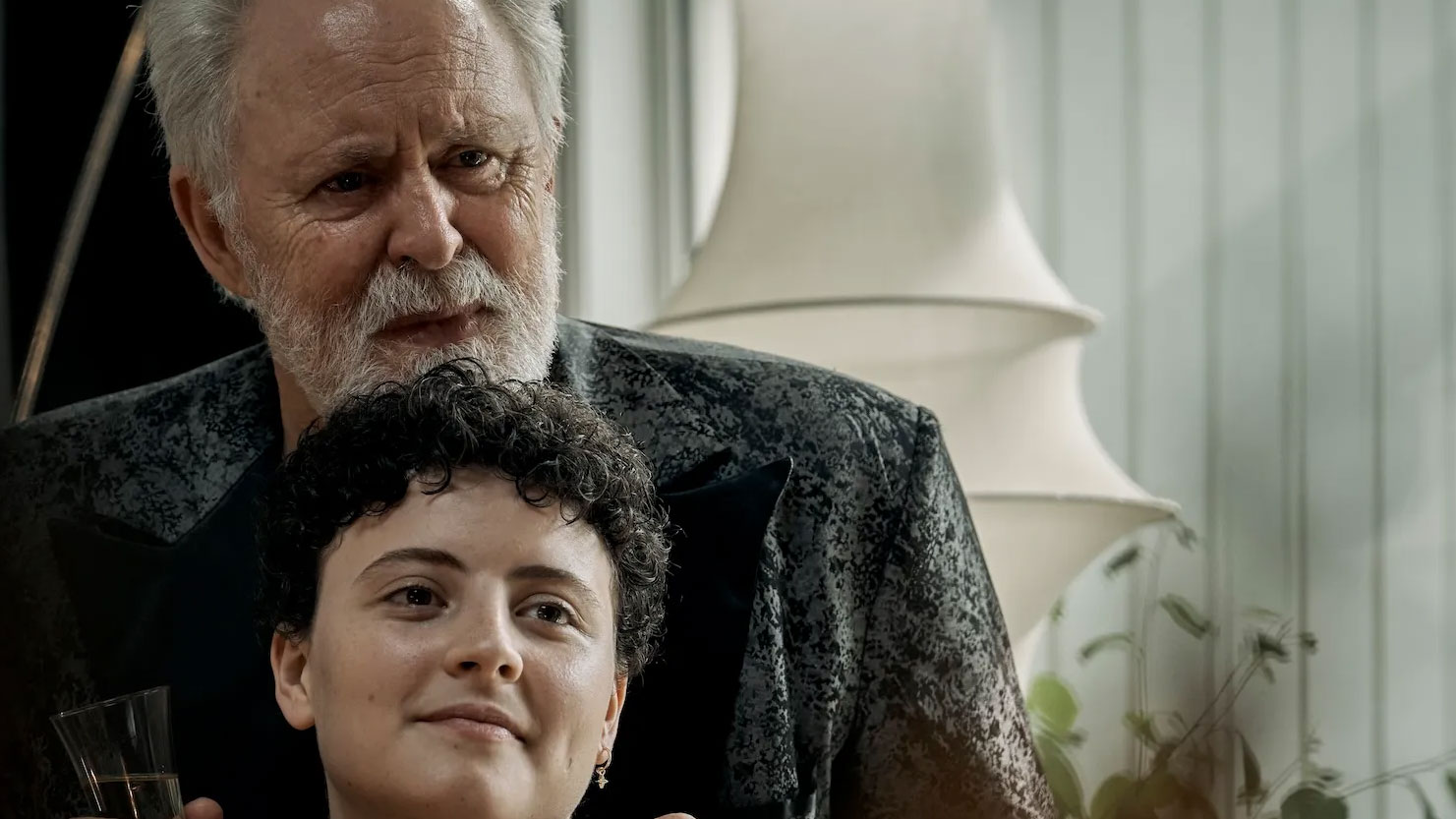 Grandfather putting hands on shoulders of grandchild