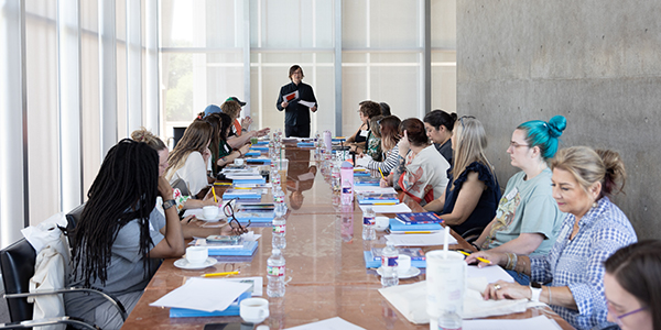 Instructor leading student teachers at table
