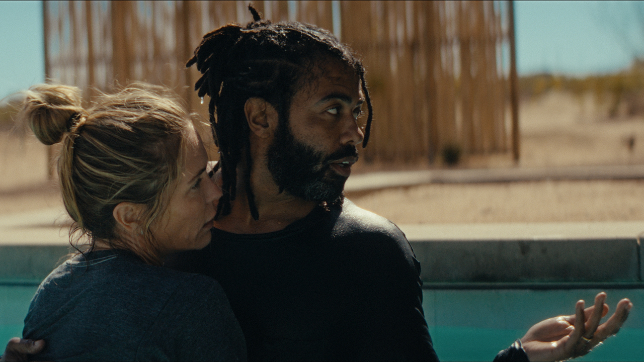 Man and woman in pool embracing