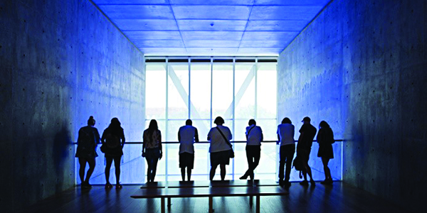 People looking through a shaded blue window