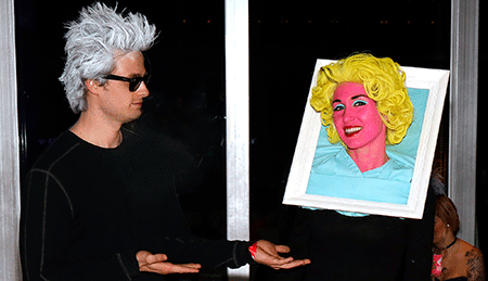 Man and woman dressed uplike Warhol and Marilyn Monroe