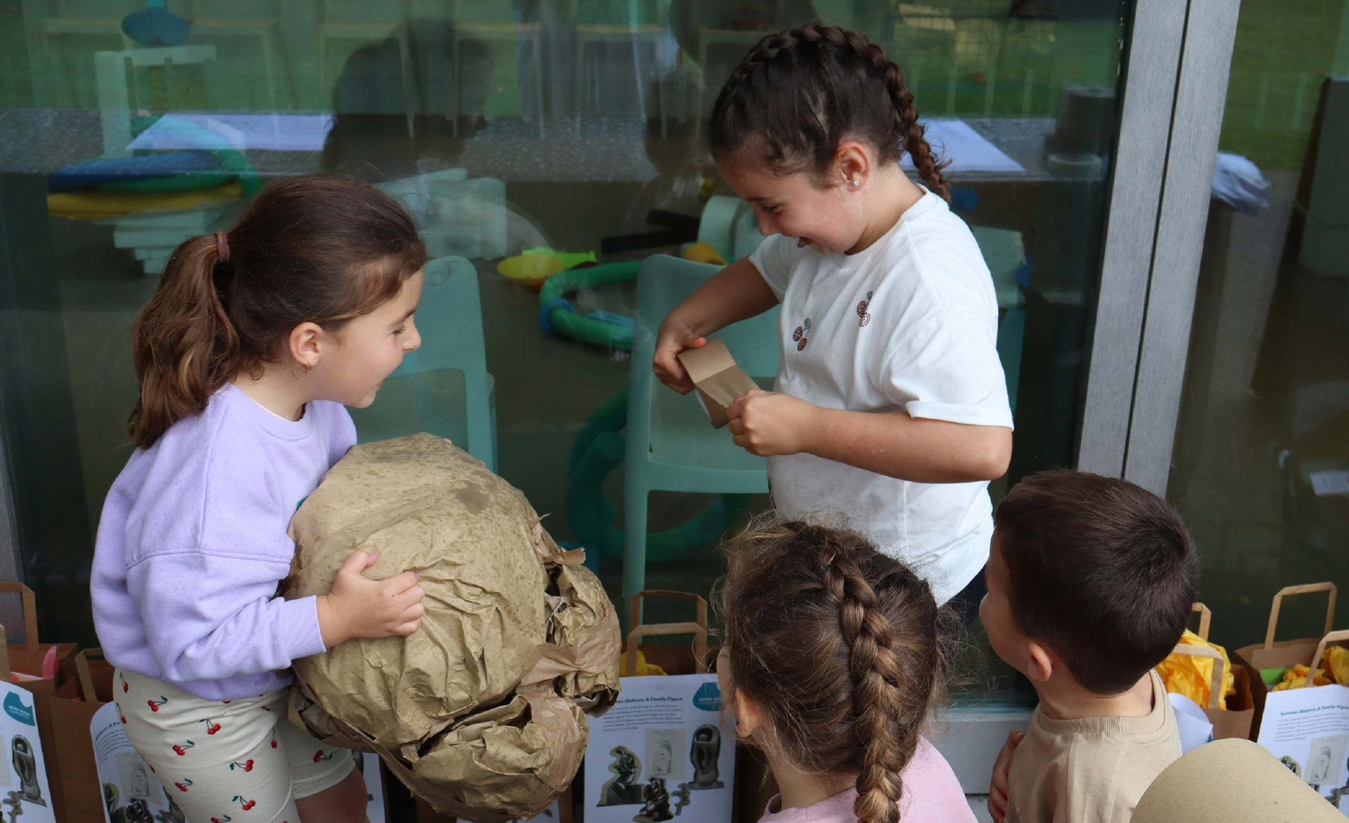 Kids making paper rocks