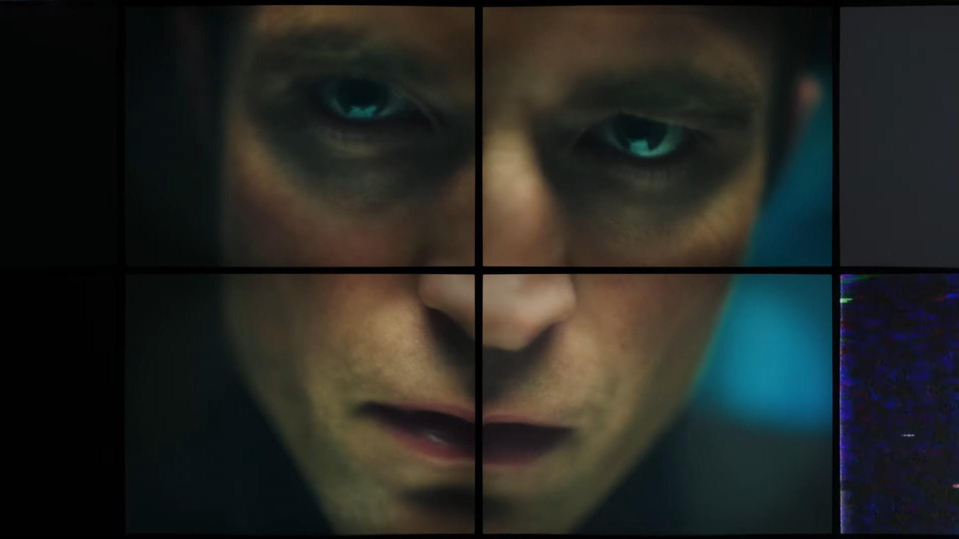 Up-close shot of a man looking into surveillance camera