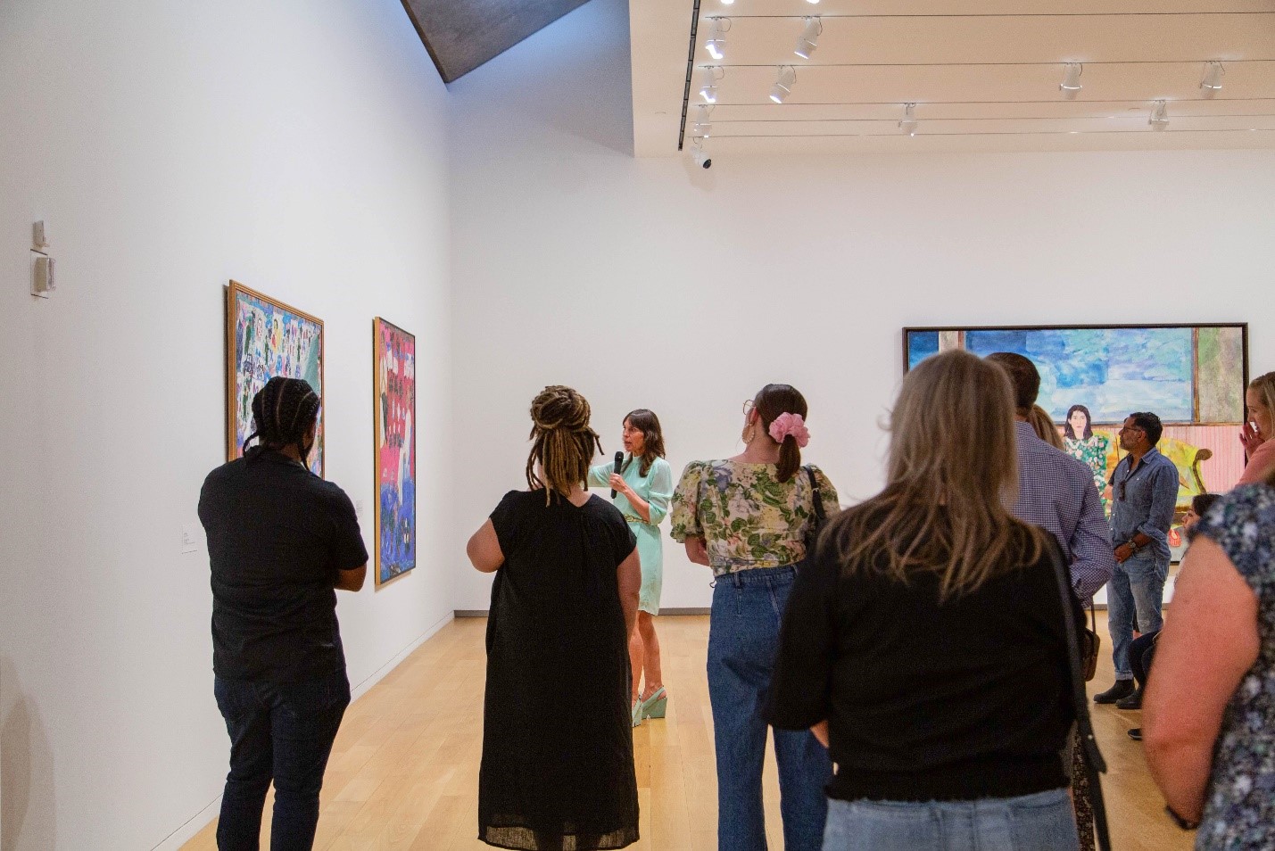 Andrea Karnes and guests in the gallery