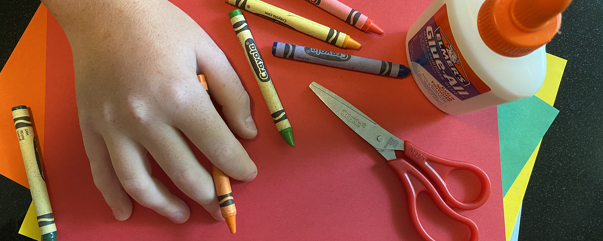 crayons, hands, scissors, glue